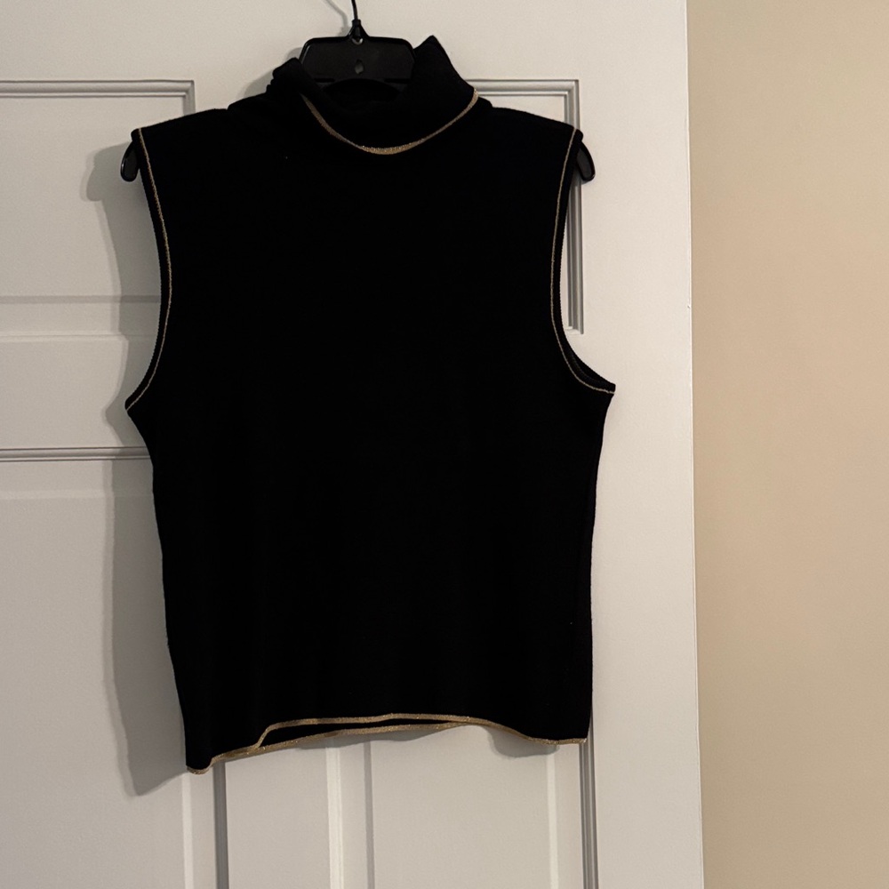 Gently used black sleeveless turtleneck top with gold trim.